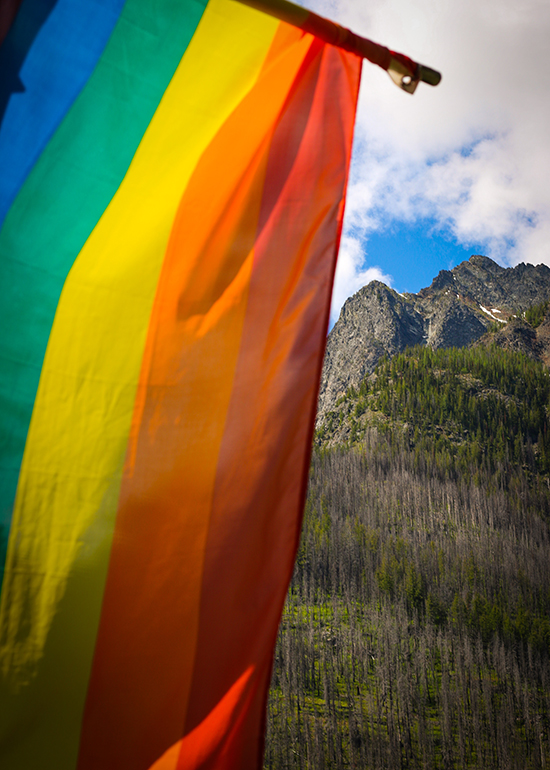 Rainbow pride flag with mountain in backdrop